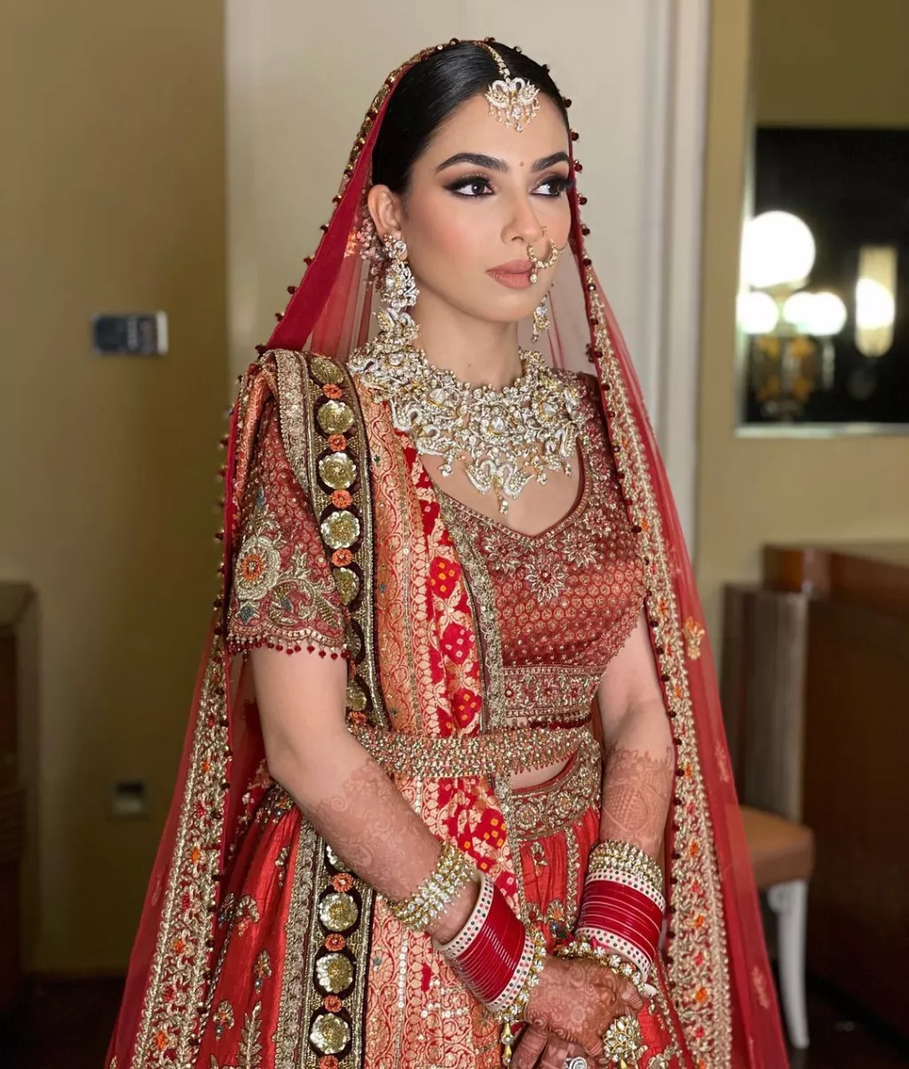 Tarun Tahiliani Bride Stunned In A Cherry Red Lehenga With Gold Threads ...