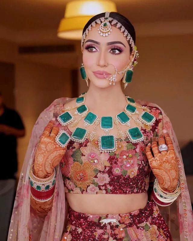 Sabyasachi Bride Wore A Maroon Lehenga, Paired It With Unique Emerald ...