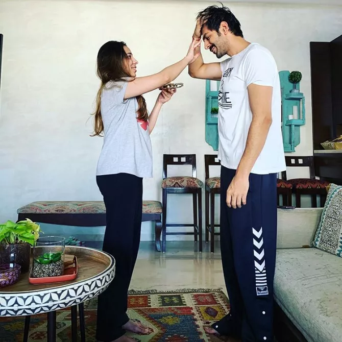 Kartik Aaryan Touching His Younger Sister, Kritika's Feet On Bhai Dooj