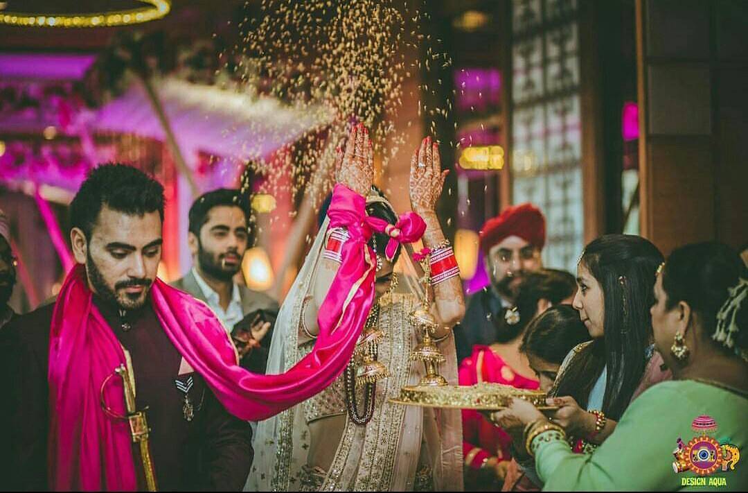 The Reason Behind An Indian Bride Throwing Rice During Her 'Vidaai' Is