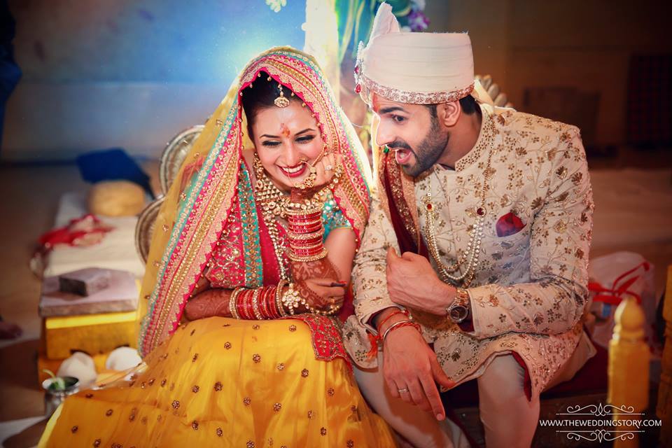 Free Photos - A Newly Married Couple Dressed In Traditional Red And Gold  Wedding Attire, Standing Together And Smiling Brightly As They Pose For A  Photo. The Bride And Groom Are The