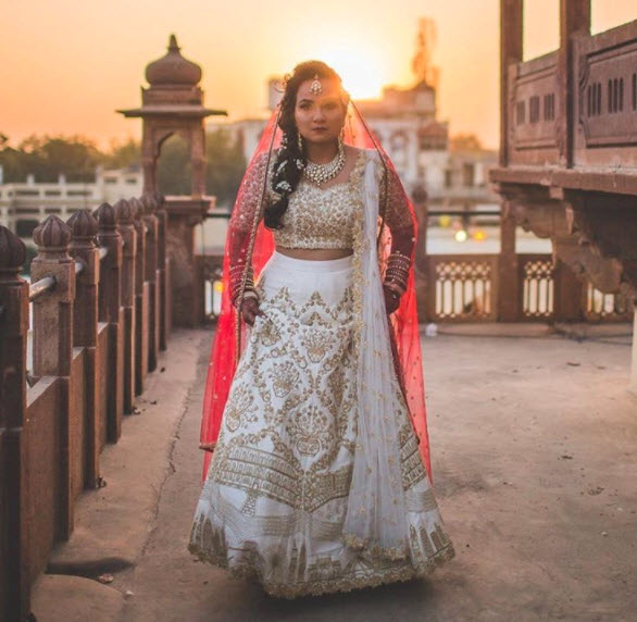 This bride switched between a pink lehenga and a white dress for her  magical Anglo-Indian wedding