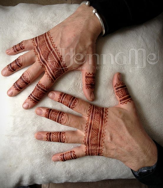 Henna Tattoo on Hand of Woman Holding Ring · Free Stock Photo