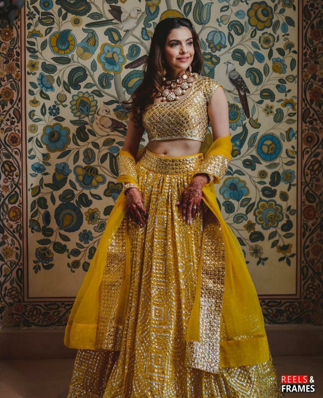 Isha Ambani wears a multicoloured embroidered Abu Jani Sandeep Khosla  lehenga | VOGUE India