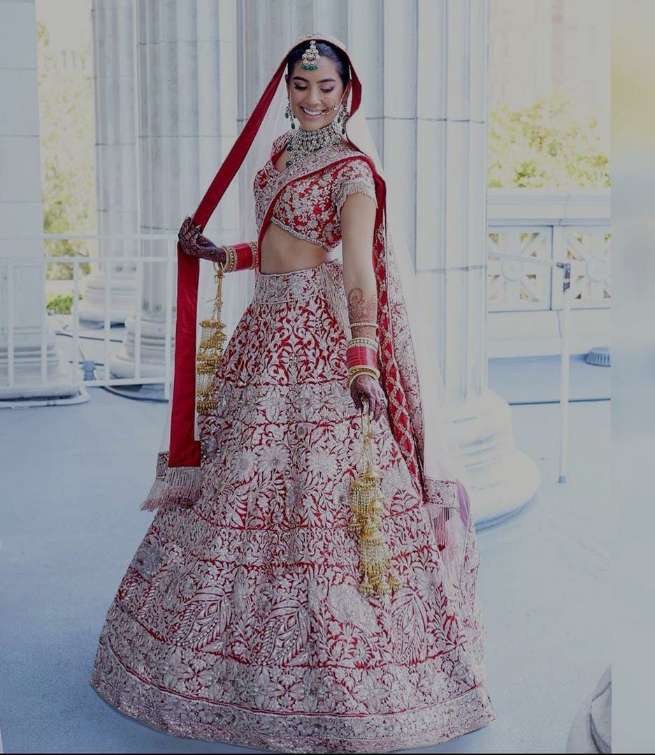 Photo of Red manish malhotra bridal lehenga