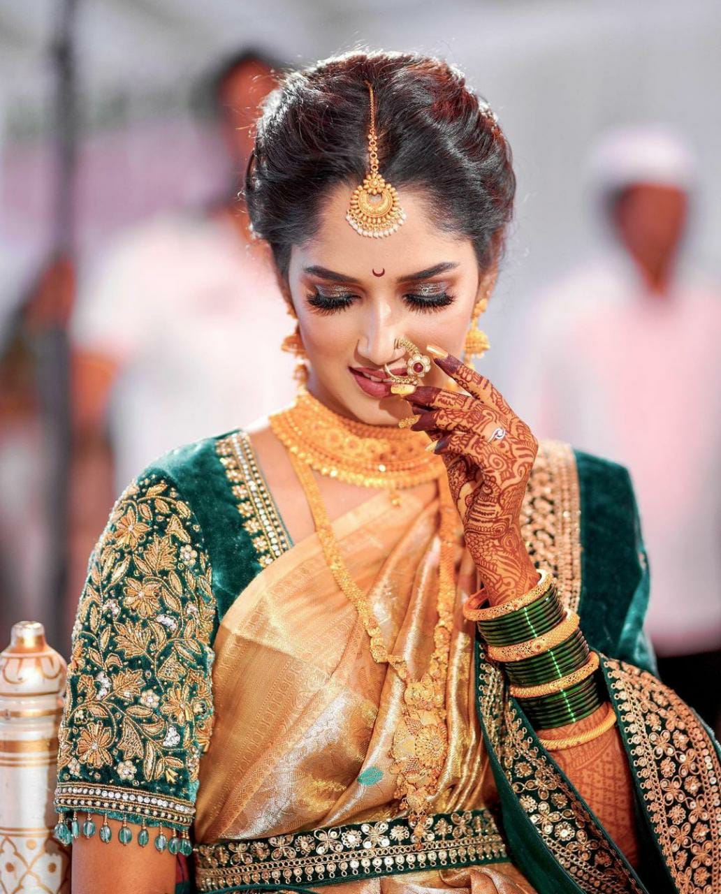 Indian model wearing traditional Maharashtrian bridal green sari and  jewelry. Looking at Camera Stock Photo - Alamy