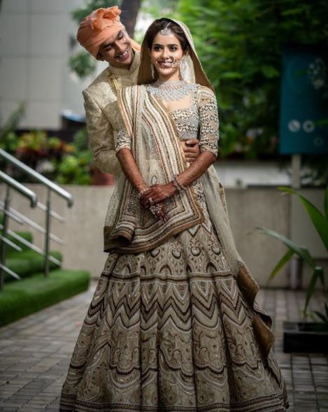 Cost Of Actress Sana Sayyad s Unique Brown And White Aztec Pattern Pearl Work Wedding Lehenga