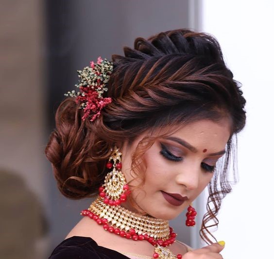Photo of Messy bun with loose curls for sister of the bride | Indian  wedding hairstyles, Bridal hair buns, Bridal hairstyle indian wedding