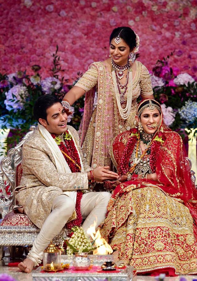 Pics: Isha-Anand at their Mumbai reception - Rediff.com