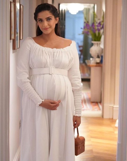 Preggers Sonam Kapoor is a vision in white in mother Sunita