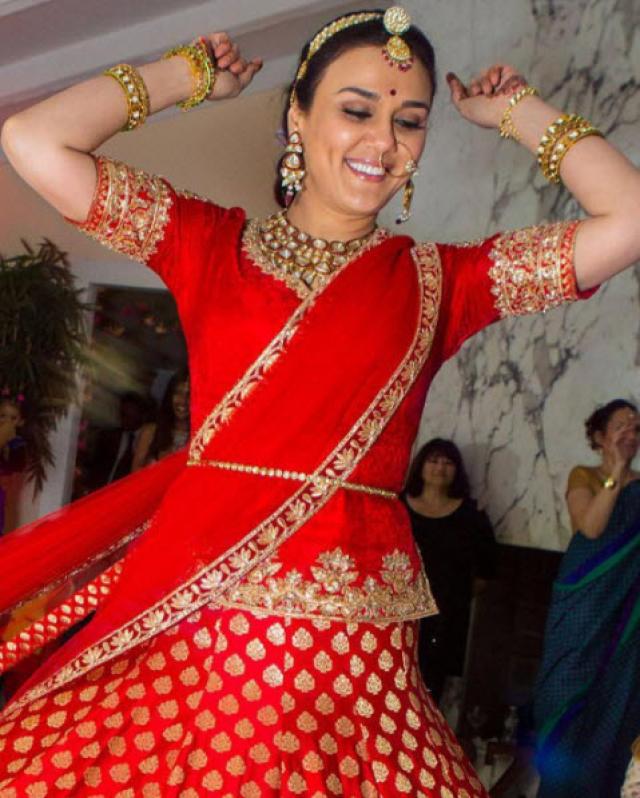 Photo of Red and white bridal lehenga with green jewellery | Indian bridal  wear, Bridal lehenga red, Indian bridal lehenga