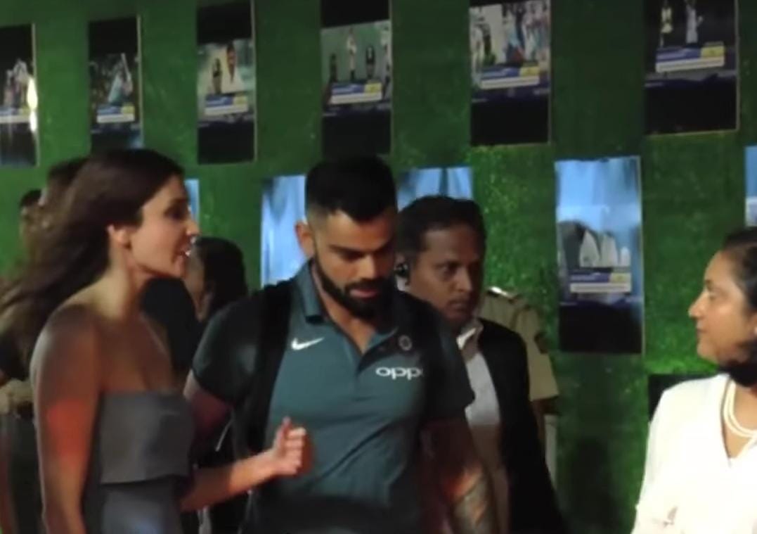 Peck it out! Virat Kohli and Anushka Sharma lock it with love