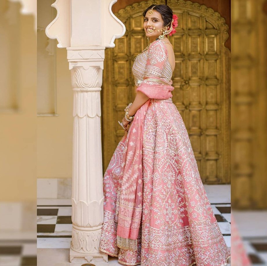 Manish Malhotra - Our coral pink lehenga handcrafted with... | Facebook