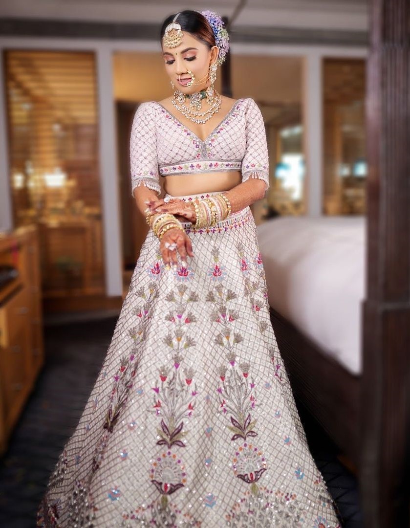 Manish Malhotra - Colours of summer, fillers of grandeur, so much to  discover The 500 hour of serene labour full ensemble is a raw silk ivory  and silver kadana embriodered geometric lehenga