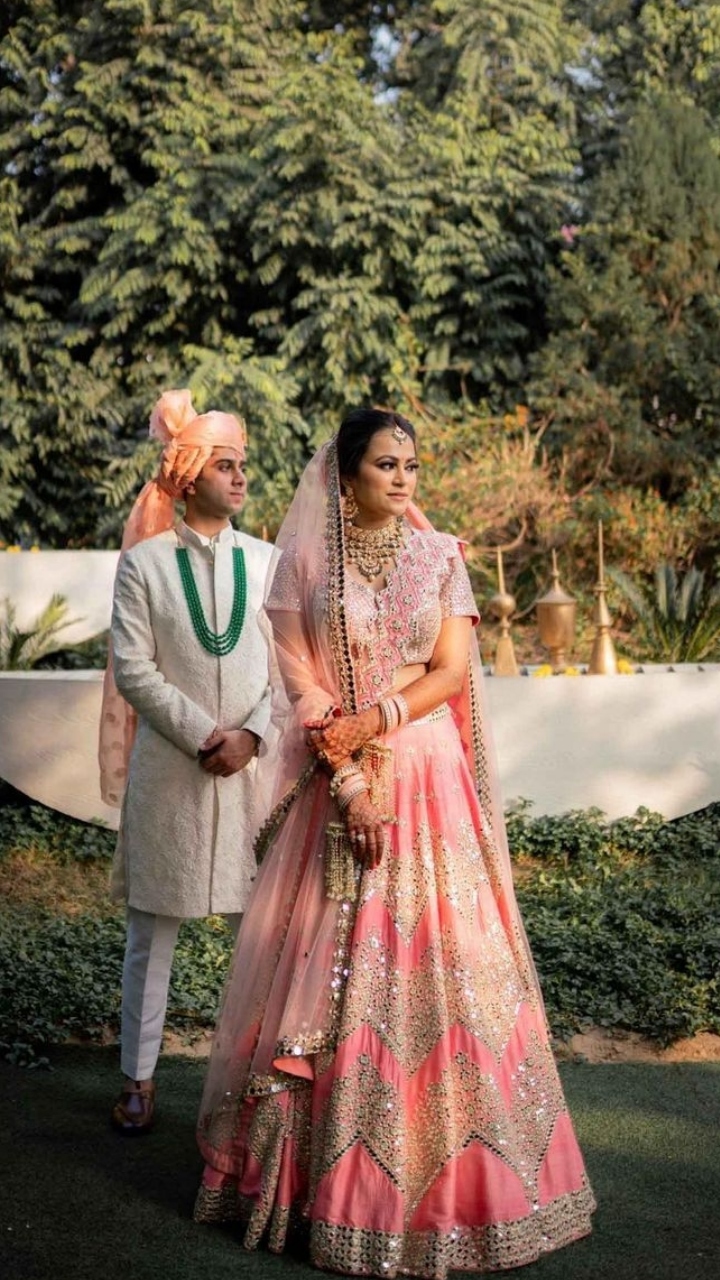 Photo of Bride in Pink Lehenga and Groom in Pink Pagdi
