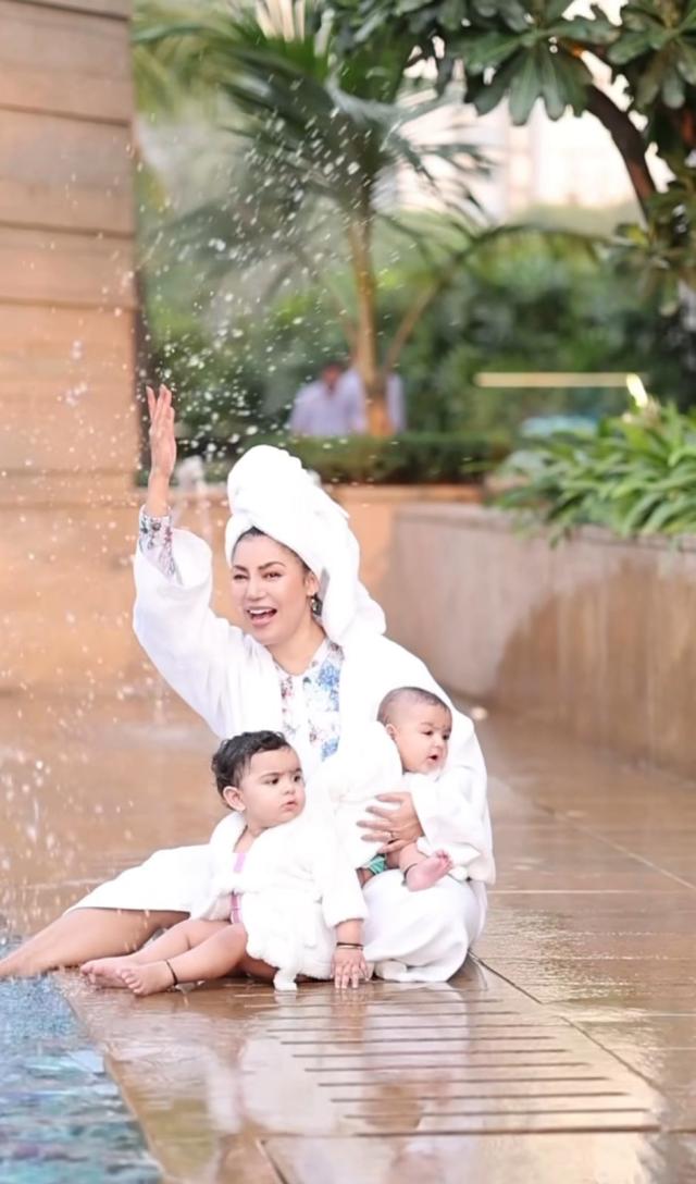 debina with her daughters at pool