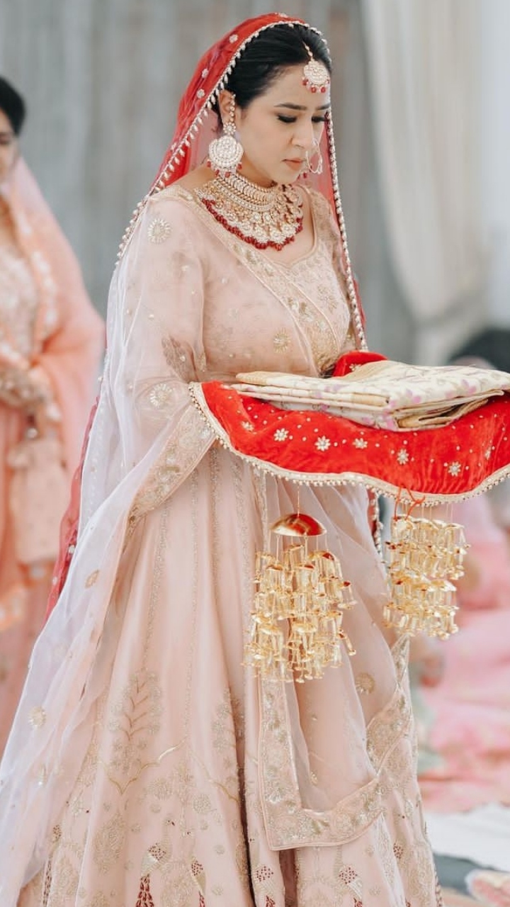 Bride Stuns In A Peach Milk Sabyasachi Lehenga With 'Hariyali' Designs, At  Her Wedding In Australia