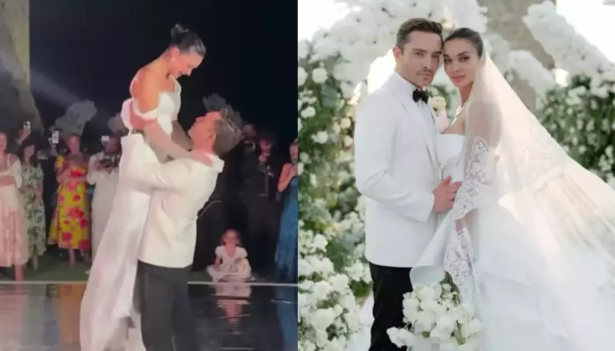 Newly married Amy Jackson blushes as her husband Ed Westwick lifts her up and kisses her during their first dance